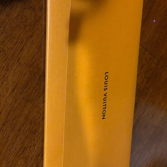 Authentic brand new larger Louis Vuitton pocket / envelope for receipts.